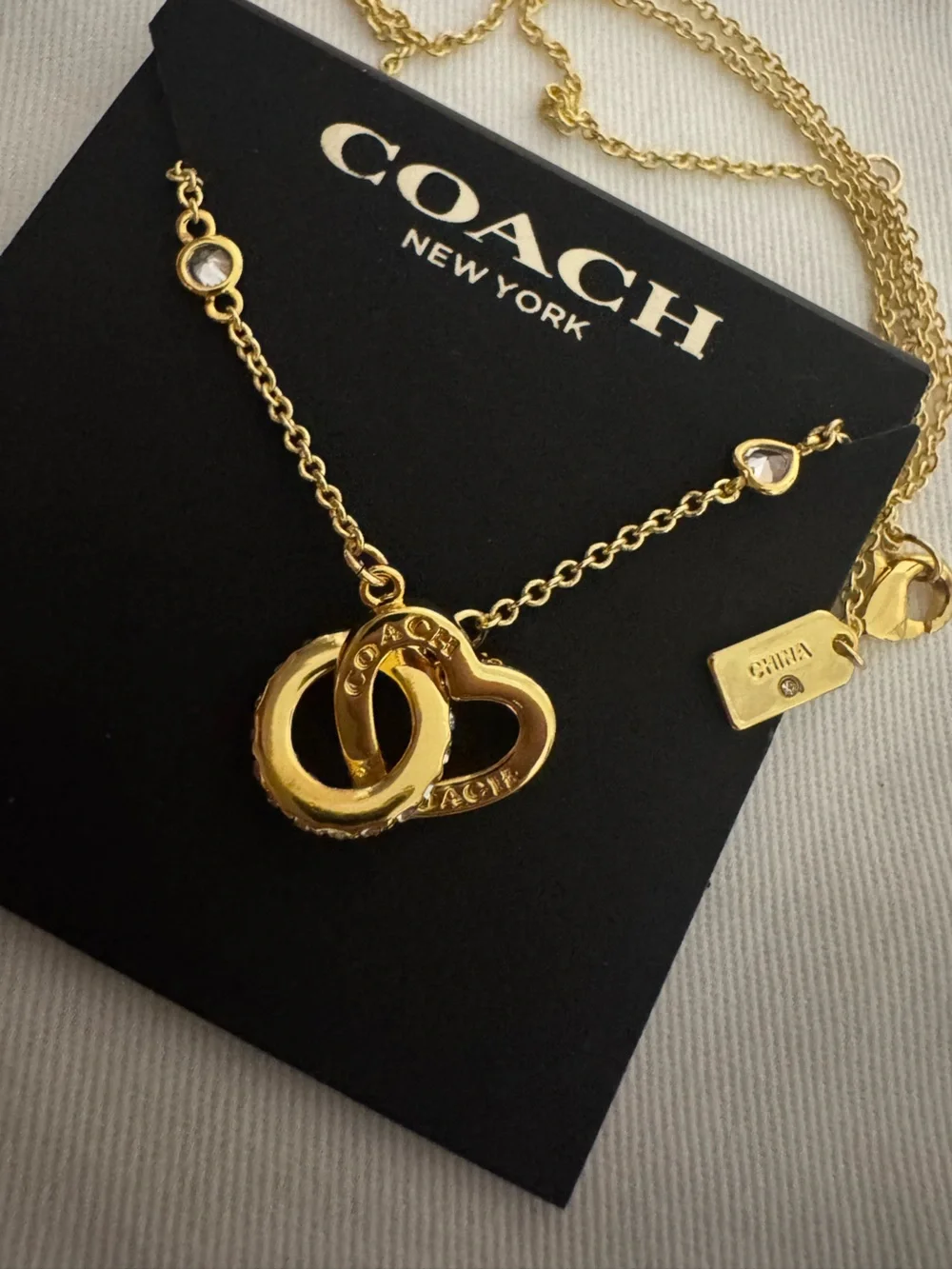 Coach Gold Interlocking Heart Necklace with Crystal Accents